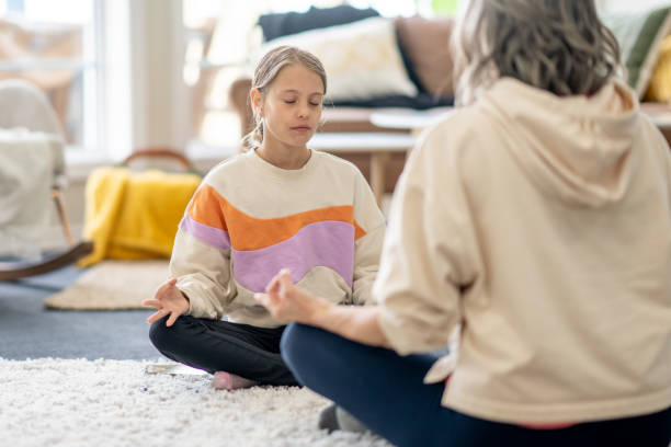 istock Mother and Daughter Meditation 1488612577