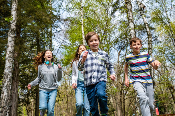 istock happy children running in the forest 1488613337