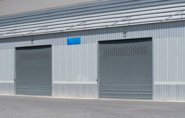 istock Shutter door and siding wall of building and warehouse. 1488613522