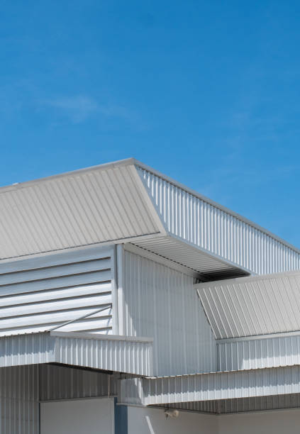 istock metal sheet roofing on commercial construction with blue sky 1488613527