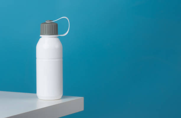 istock White sport plastic water bottle on a blue background 1488613543