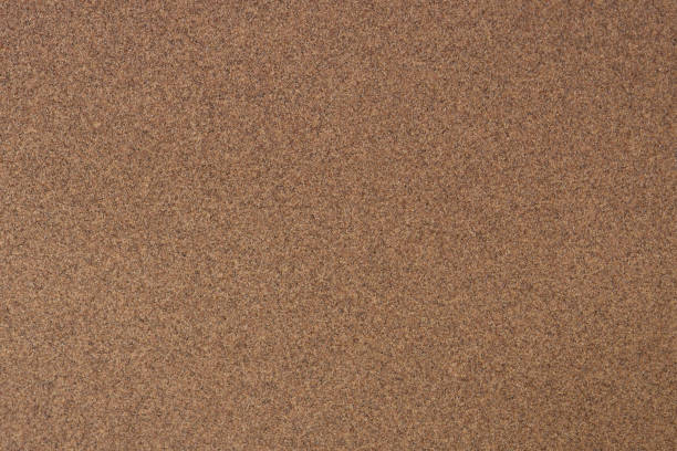 istock Texture of brown sandpaper.Rough sandpaper background. 1488613568