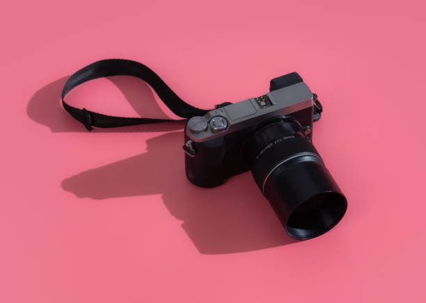 istock Vintage camera on pink pastel background,Flat lay with copy space 1488614169