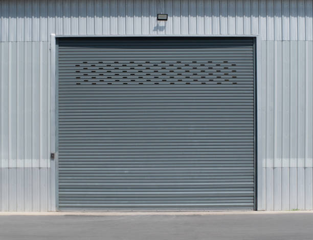 istock Shutter door and siding wall of building and warehouse. 1488614248