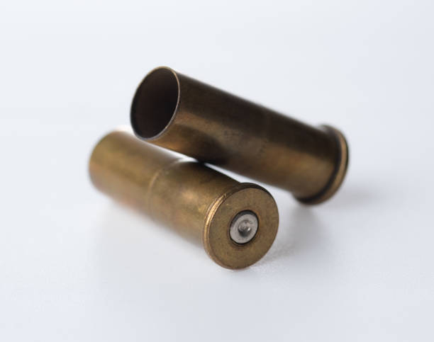 istock Brass bullet shells, 38 size for revolver handgun on white background 1488614432