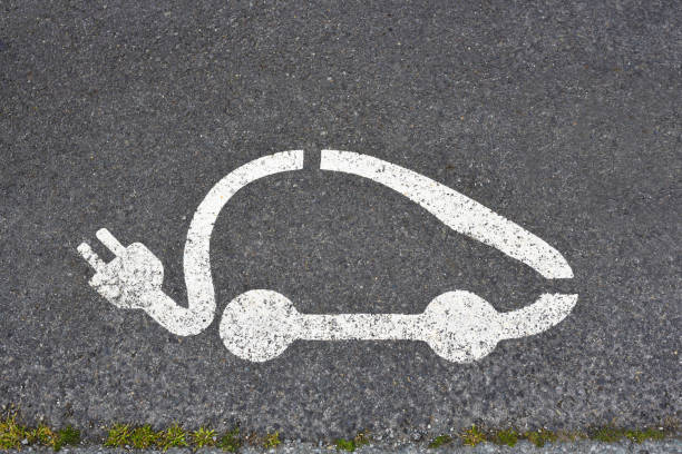 istock Symbol on asphalt electric car 1488614444