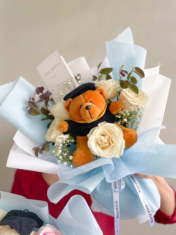 Graduation bouquet with teddy bear and roses