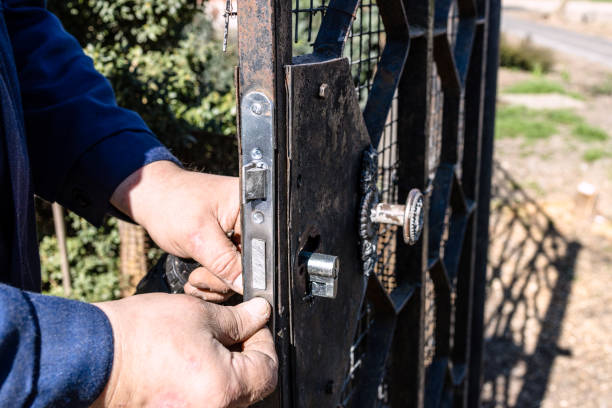 istock worker changes cylinder of door lock outdoors 1488616492