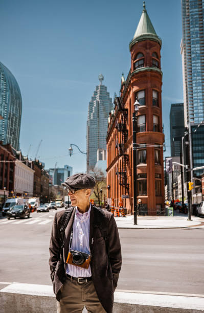 istock Senior man sightseeing downtown Toronto 1488616727
