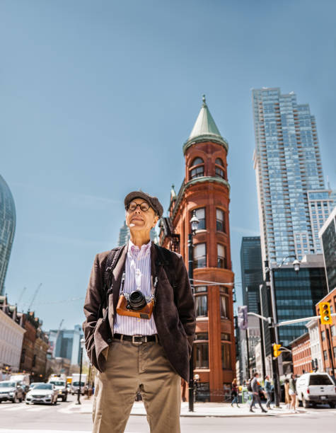 istock Senior man sightseeing downtown Toronto 1488616734