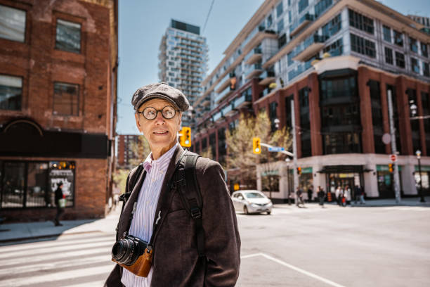istock Senior man sightseeing downtown Toronto 1488616743