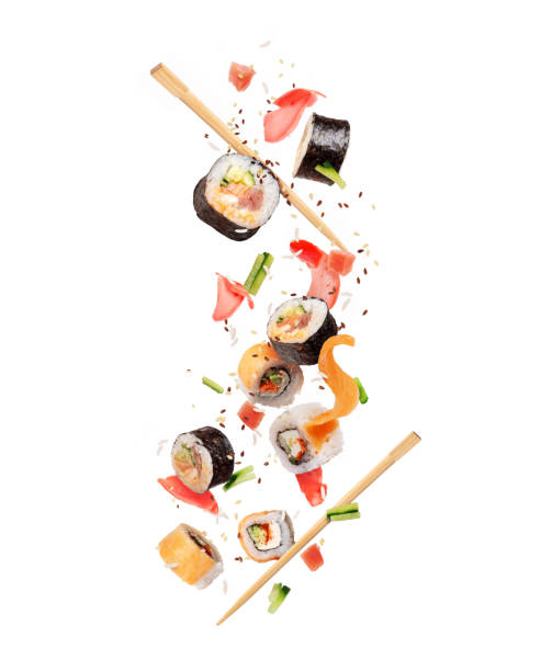 istock Fresh sushi rolls with various ingredients are falling down 1488620590