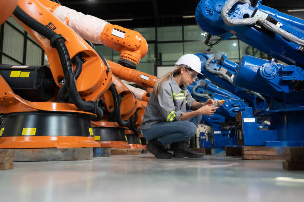istock In the robots warehouse, A female engineer inspects the electrical system of every robotics arm, before delivering to the customer. 1488621039
