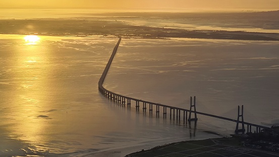 Golden sunrise over beautiful Lisbon bay