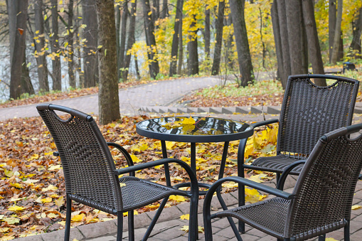 Chairs and table in an empty autumn park