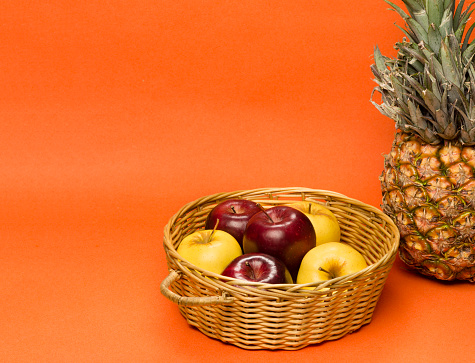 Basket full of fresh different tropical fruits