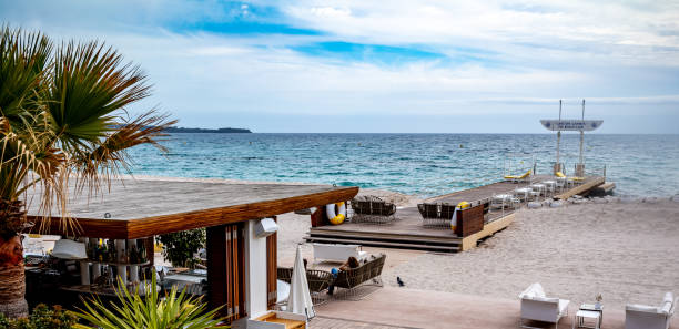 Views of the luxury Carlton Hotel Beach Club on the Mediterranean Sea in Cannes, France.  Since 1930, The Carlton Hotel Beach Club in Cannes, France  has been the sought after spot to relax on the beach and enjoy the scenery of the Mediterranean Sea which surrounds Cannes.