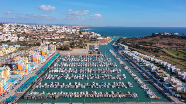 Aerial view portuguese fishing tourist town Albufuira with creative architecture. Portugal Algarve. harbour for yachts stock photo