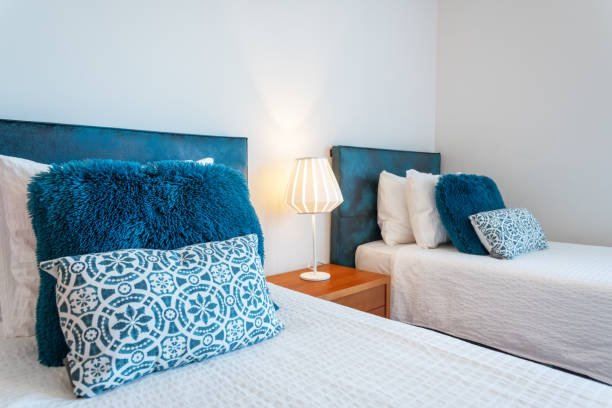 istock Decorative multi-colored fluffy pillows in three rows on the bed in the bedroom. 1488632358