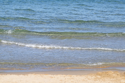 Striking scene of waves breaking on the sand of a Spanish beach