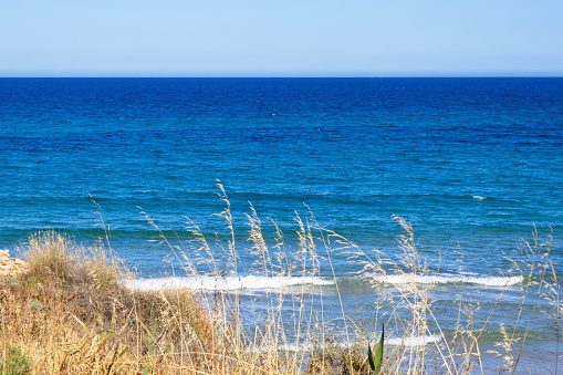 Striking scene of waves breaking on the sand of a Spanish beach