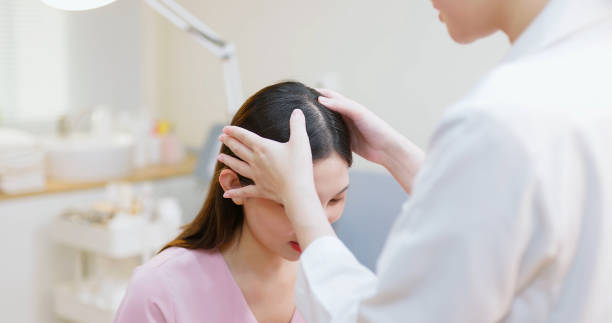 istock doctor examines scalp with hands 1488632606