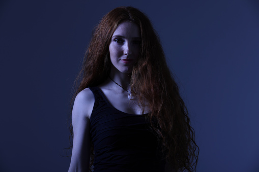 Red Hair Girl with blue background and copy space