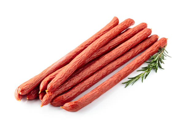 istock Smocked sausages with rosemary isolated on white. 1488635151