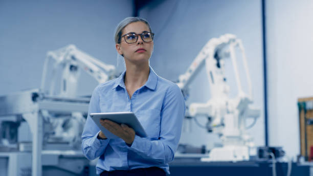 Thinking, engineering and woman on tablet in manufacturing for research, analytics and machine design. Futuristic technology, industry 4.0 and female engineer on digital tech for robotic system idea