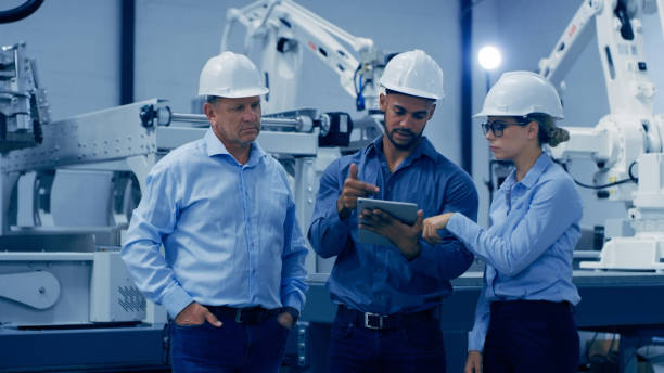 istock Automation, engineering and people planning on tablet in lab for analysis, research and machine. Technology, discussion and engineer team on digital tech for robotic system, equipment and software 1488638499