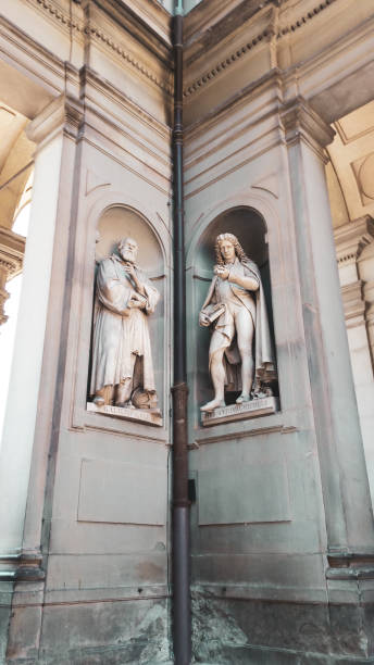 Galileo Galilei and Pier Antonio Micheli, Street sculpture Uffizi Gallery outside in Florence, Italy Galileo Galilei and Pier Antonio Micheli, Street sculpture Uffizi Gallery outside in Florence, Italy michelangelo italy art david stock pictures, royalty-free photos & images