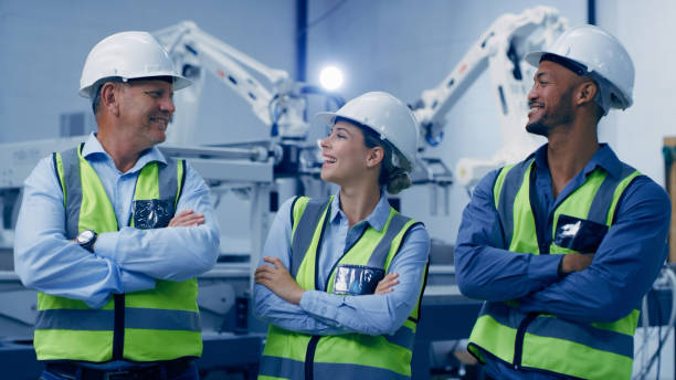 istock Automation warehouse, robot and people in lab for analysis and engineering design for machine. Futuristic technology, teamwork and happy men and woman in robotic, industry 4.0 and digital factory 1488639868