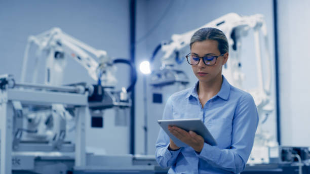 istock Engineering, planning and woman on tablet in automation lab for research, analytics and machine prototype. Futuristic technology, industry 4.0 and female worker on digital tech for robotics system 1488640229