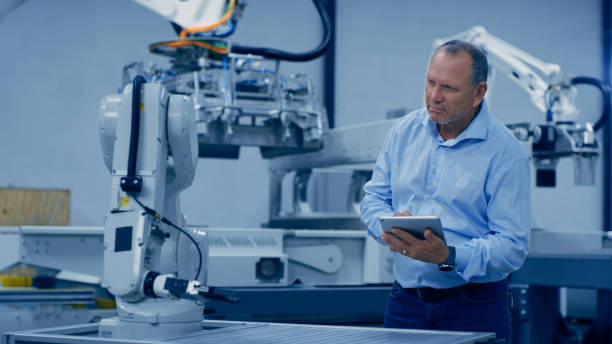 Robotics worker, tablet and man doing machine, automation and technology check in a lab. Engineering, futuristic and research innovation of a employee working on biotechnology and science analytics trabajador de robótica, tableta o hombre en máquina, automatización y tecnología de verificación en laboratorio. innovación de ingeniería, futurista e investigación de un empleado maduro que trabaja y piensa en la analítica de la industria 4.0