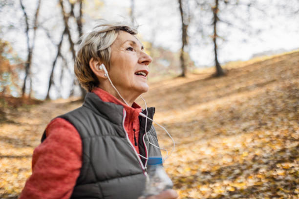 istock Senior woman jogging in park 1488642679
