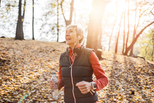 istock Senior woman jogging in park 1488642694