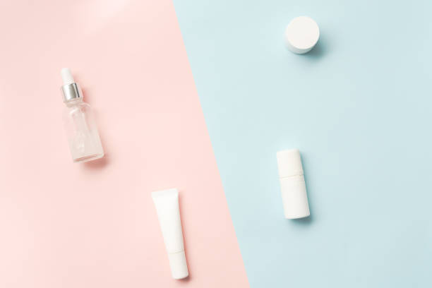 istock Creative flat lay of cosmetic bottles and jars on two colored background 1488642998