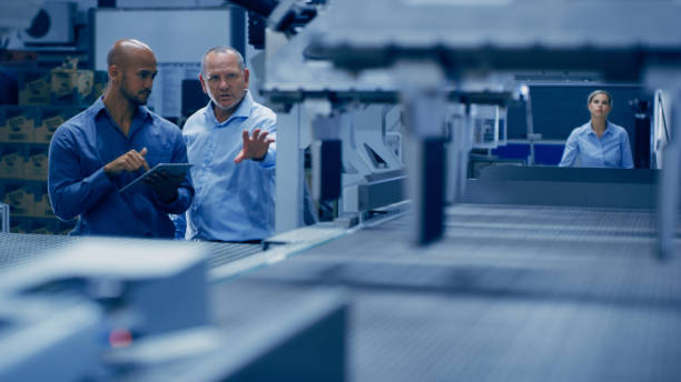 istock Automation, tablet and men in lab for planning, research and machine inspection for engineering design. Technology, collaboration and engineers group on digital tech for robotics, system and software 1488643972