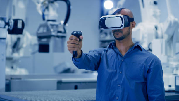istock Virtual reality, automation and innovation with an engineer man using technology to access the metaverse in a factory. Robotics, industry 4.0 and vr goggles with a male warehouse employee in a plant 1488643992