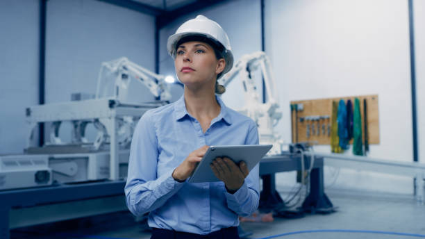 istock Tablet, machine and engineering woman in factory maintenance, programming or manufacturing of industry 4.0. Technician person thinking of robotics, electronics or automation on digital technology app 1488644079