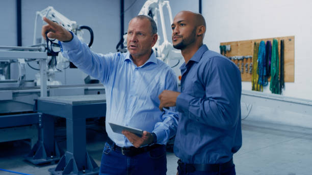 istock Engineering, tablet and men in laboratory planning for analysis, research and automation machine. Technology, collaboration and engineer team on digital tech for robotic equipment and software 1488644108