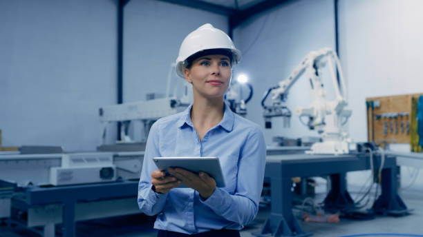 istock Tablet, machine and engineering woman in factory maintenance, programming or manufacturing of industry 4.0. Technician person thinking of robotics, electronics or automation on digital technology app 1488644111