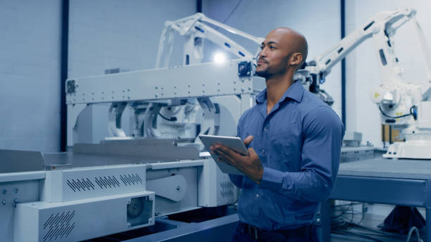 istock Idea, tablet and automation with a man engineer working in a factory for machine robotics or innovation. Industry 4.0, futuristic or technology with a male employee thinking in a production warehouse 1488644129