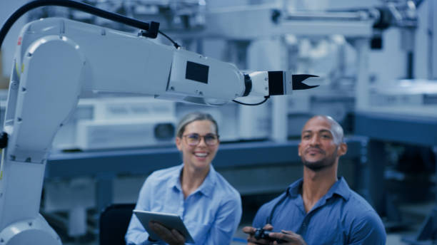 istock Engineering, robot and happy engineers in lab with machine for analysis, research and inspection test. Technology, teamwork and man and woman on digital tablet for robotic equipment and software 1488644337