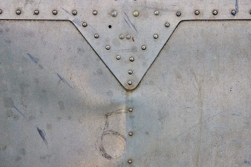 Image of Airplane wing texture asset of sheet metal with bolts and overlapping sheets
