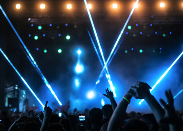 istock Large group of people at a concert party. 1488645533