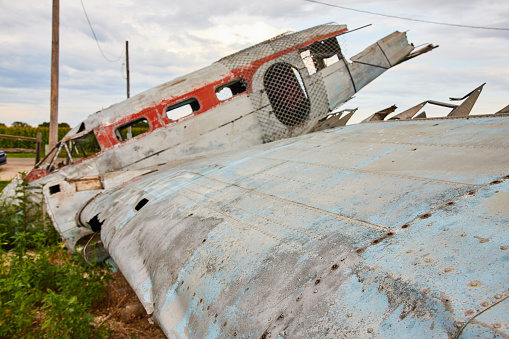 Image of Detail of wing on abandoned airplane crashed in field