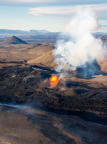 An aerial view of an erupting volcano in Iceland.