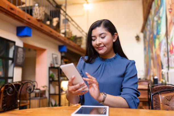 istock Young woman checking company notifications remotely 1488649630