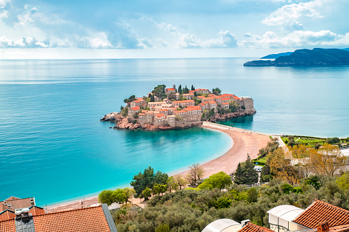 Top view of the island and the beach of Sveti Stefan in Budva.